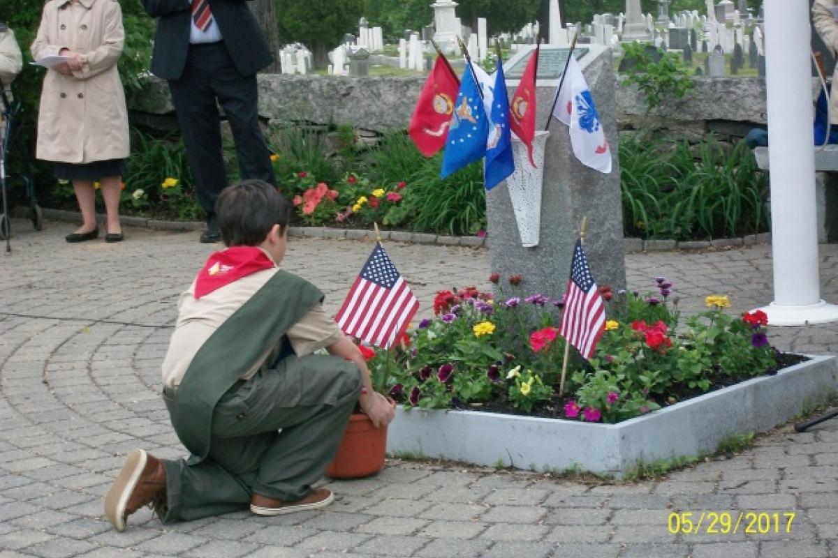 Boy Scout Placing Memorial Day Flowers